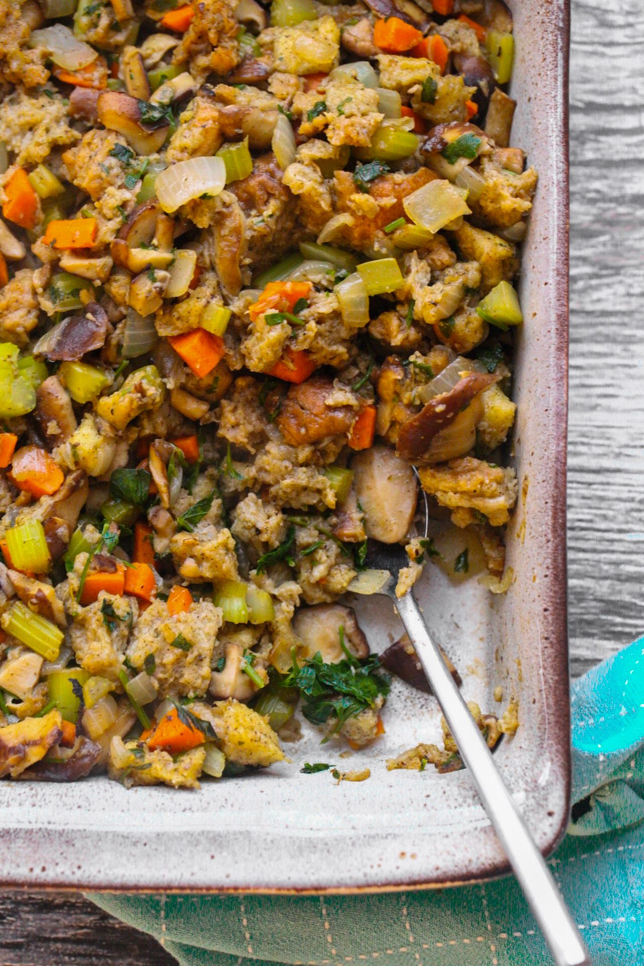 Vegan mushroom stuffing with bread cubes, tender mushrooms, celery, carrots, herbs and vegan sausage.