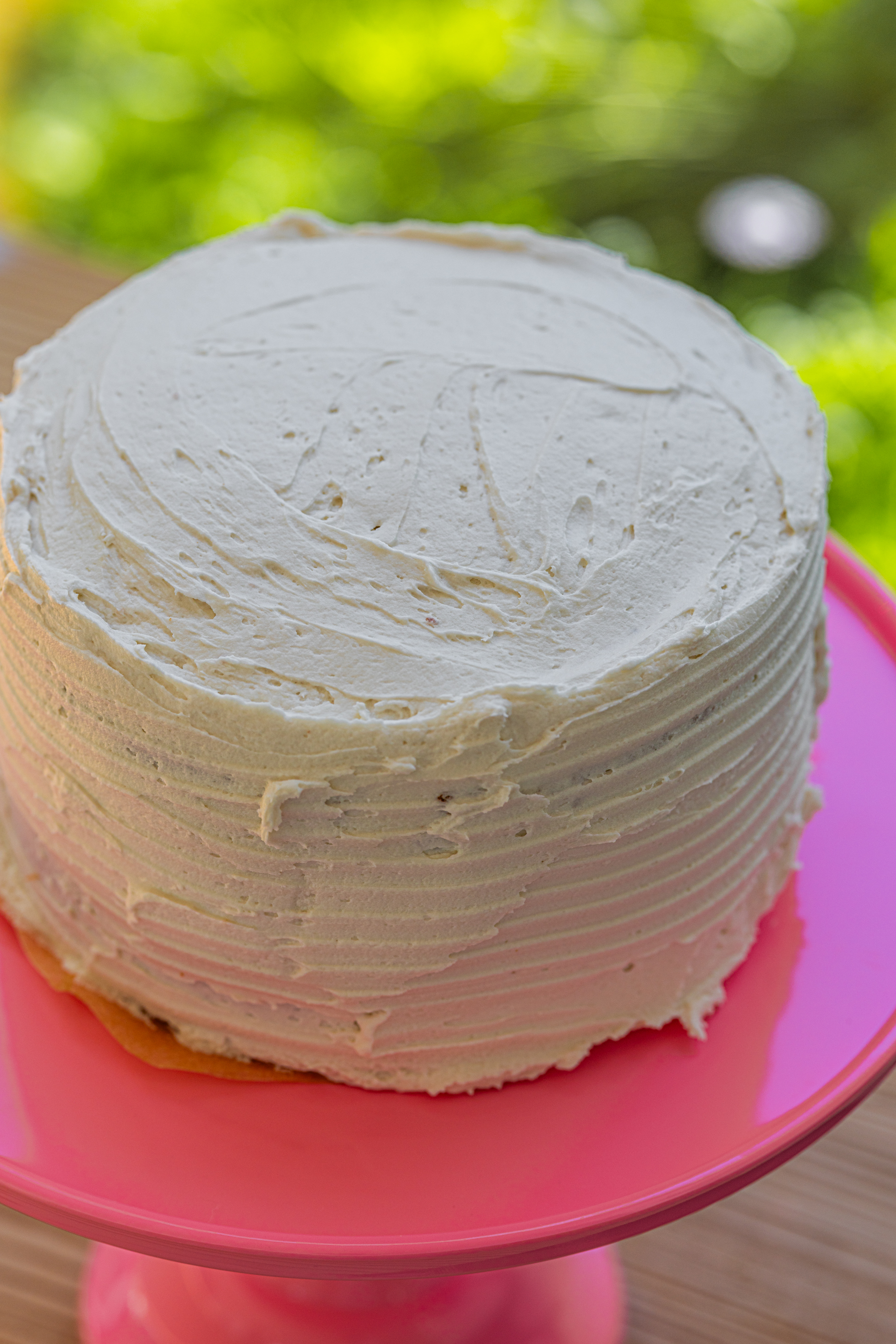 Vegan, soy-free birthday cake with fluffy vanilla layers and creamy vanilla frosting.