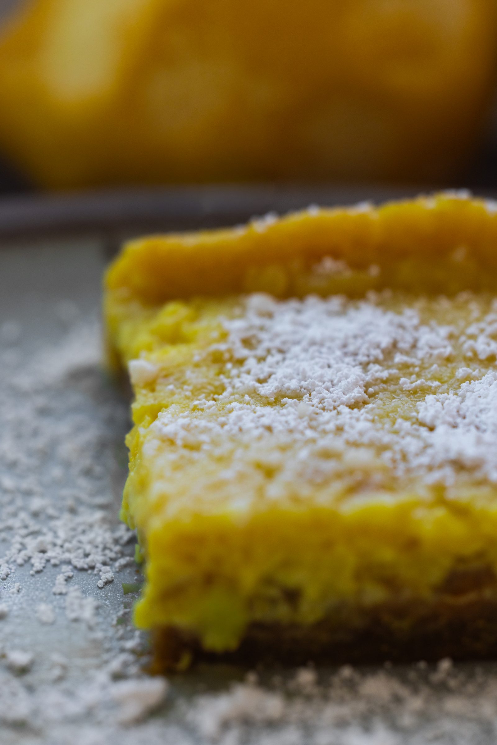 Creamy vegan lemon bars with a silky tofu-based lemon filling and a buttery graham cracker crust.