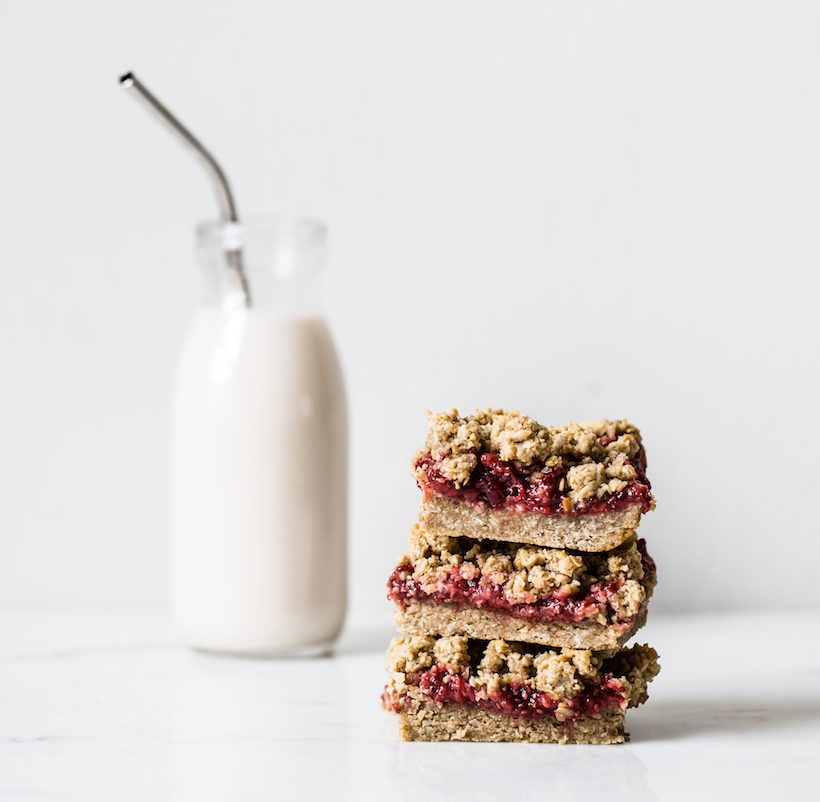 Vegan strawberry oat crumble bars with strawberry vanilla chia seed jam and a crumbly oat topping.