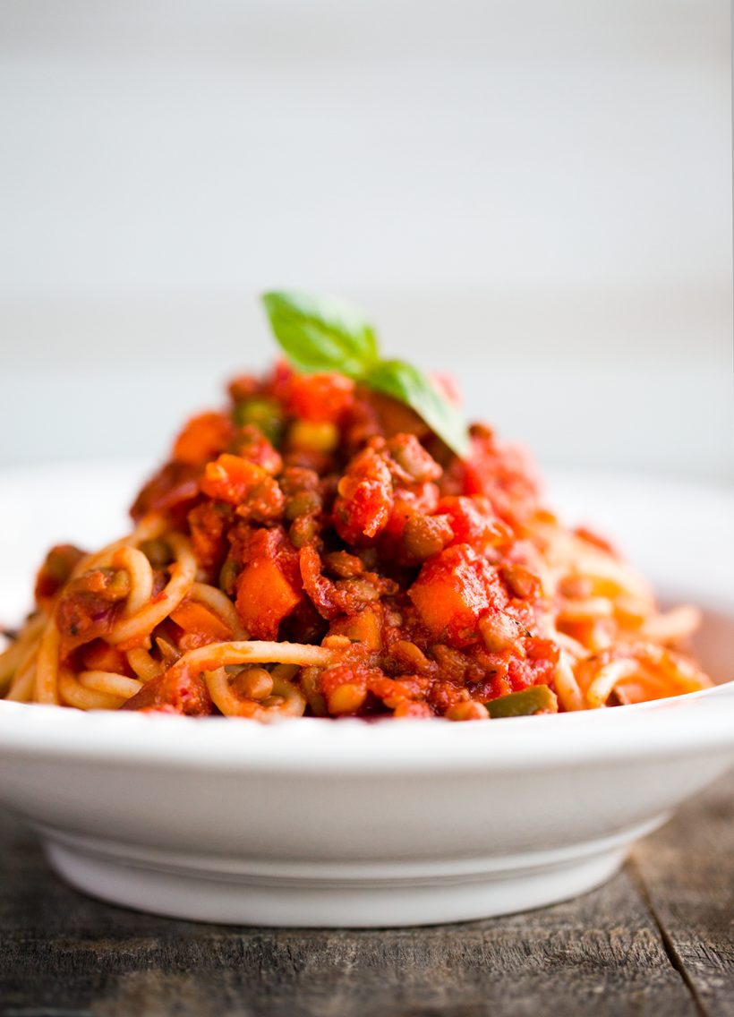 Spaghetti topped with hearty lentil bolognese sauce with tomatoes, carrots, onion and garlic.