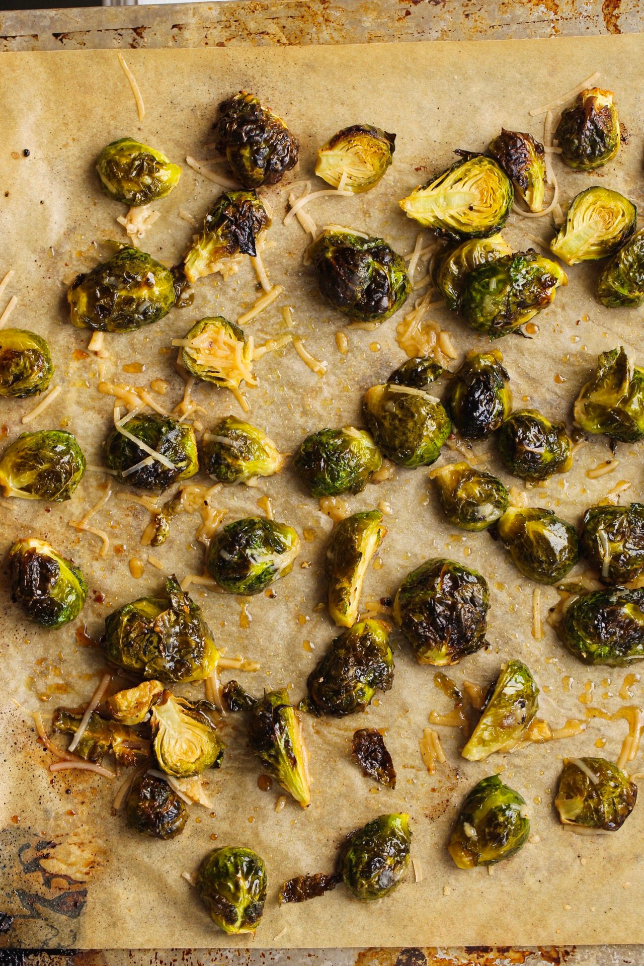 Maple roasted Brussels sprouts with caramelized edges and a sticky sweet and savory glaze.