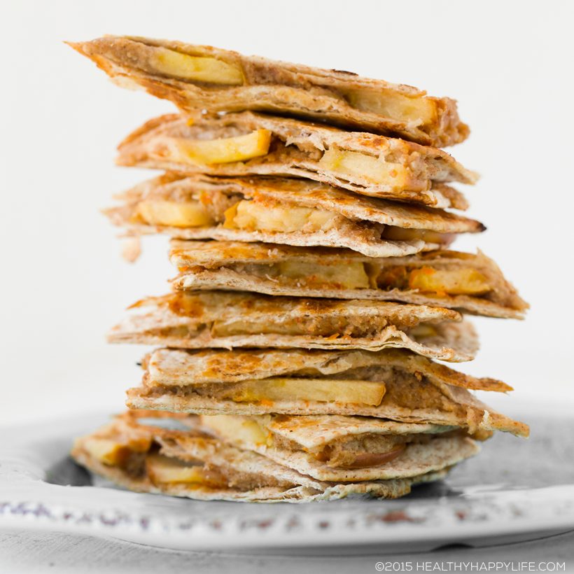 Skillet-toasted whole wheat tortilla triangles filled with apple slices and apple butter cashew cheese, served with cinnamon coconut yogurt dip.