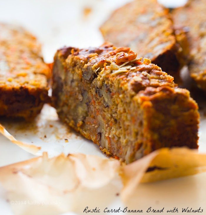 Rustic carrot-banana bread with walnuts, shredded carrots and rolled oats.