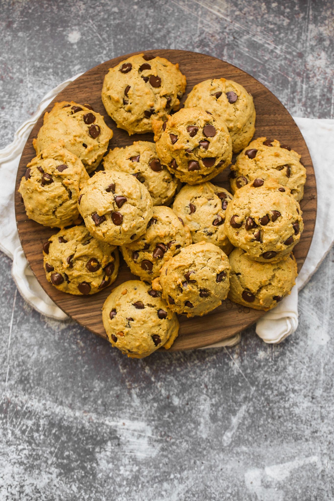 Soft, fluffy maple-sweetened peanut butter cookies studded with chocolate chips and rolled oats.