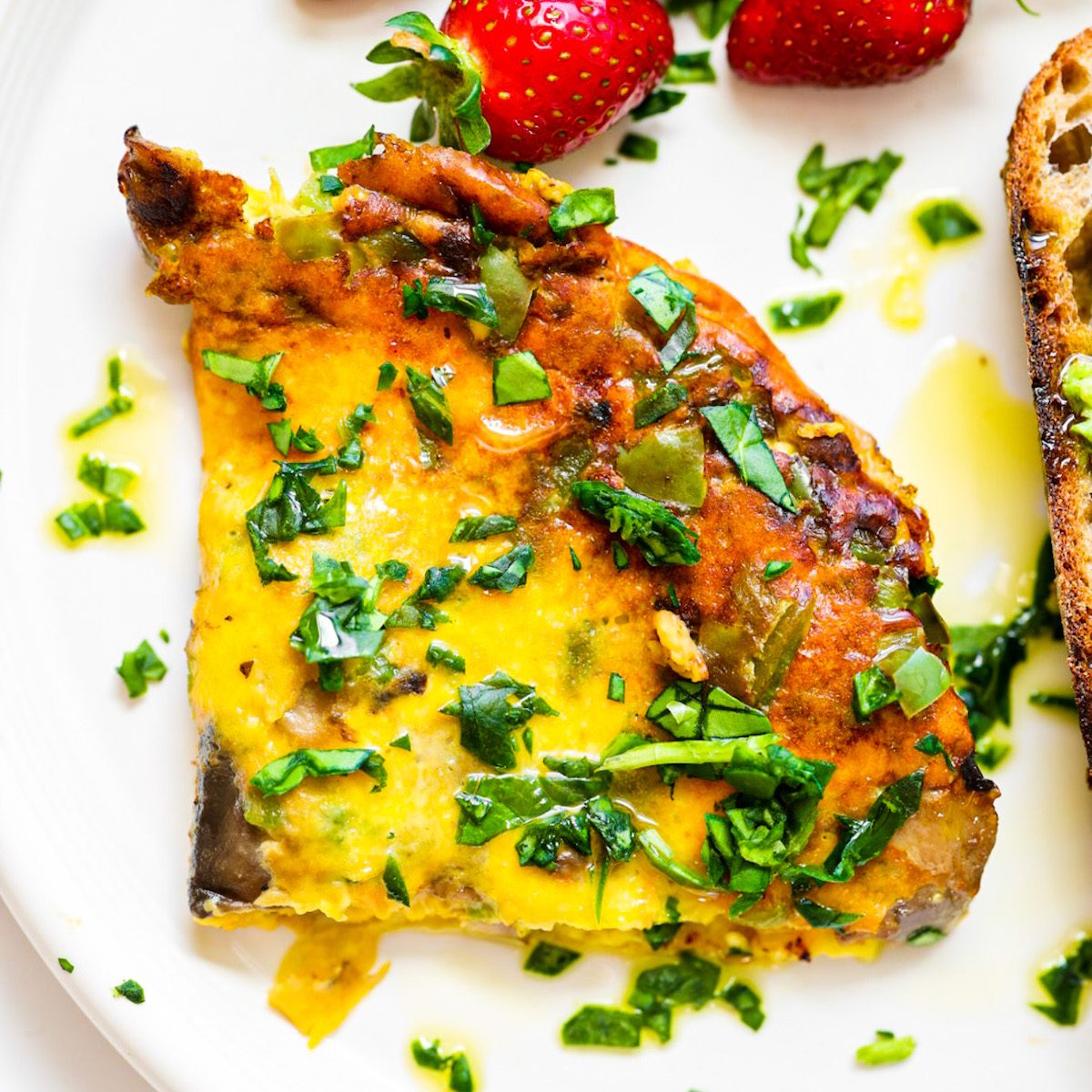 Fluffy vegan JUST Egg omelet filled with green bell peppers, mushrooms and melted vegan cheese.