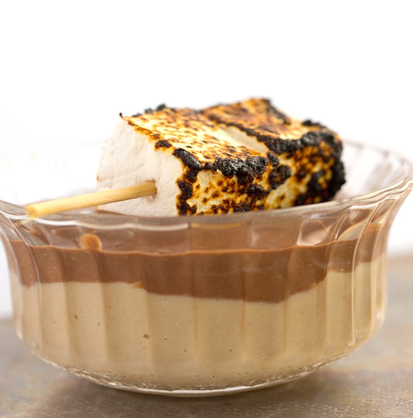 Layered chocolate and peanut butter tofu pudding cups topped with toasted vegan marshmallows.