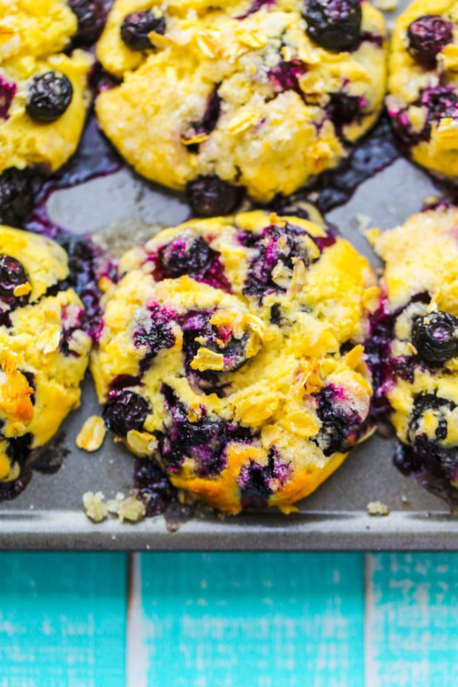 Vegan blueberry muffins with sugary golden tops and plump blueberries throughout their fluffy crumb.