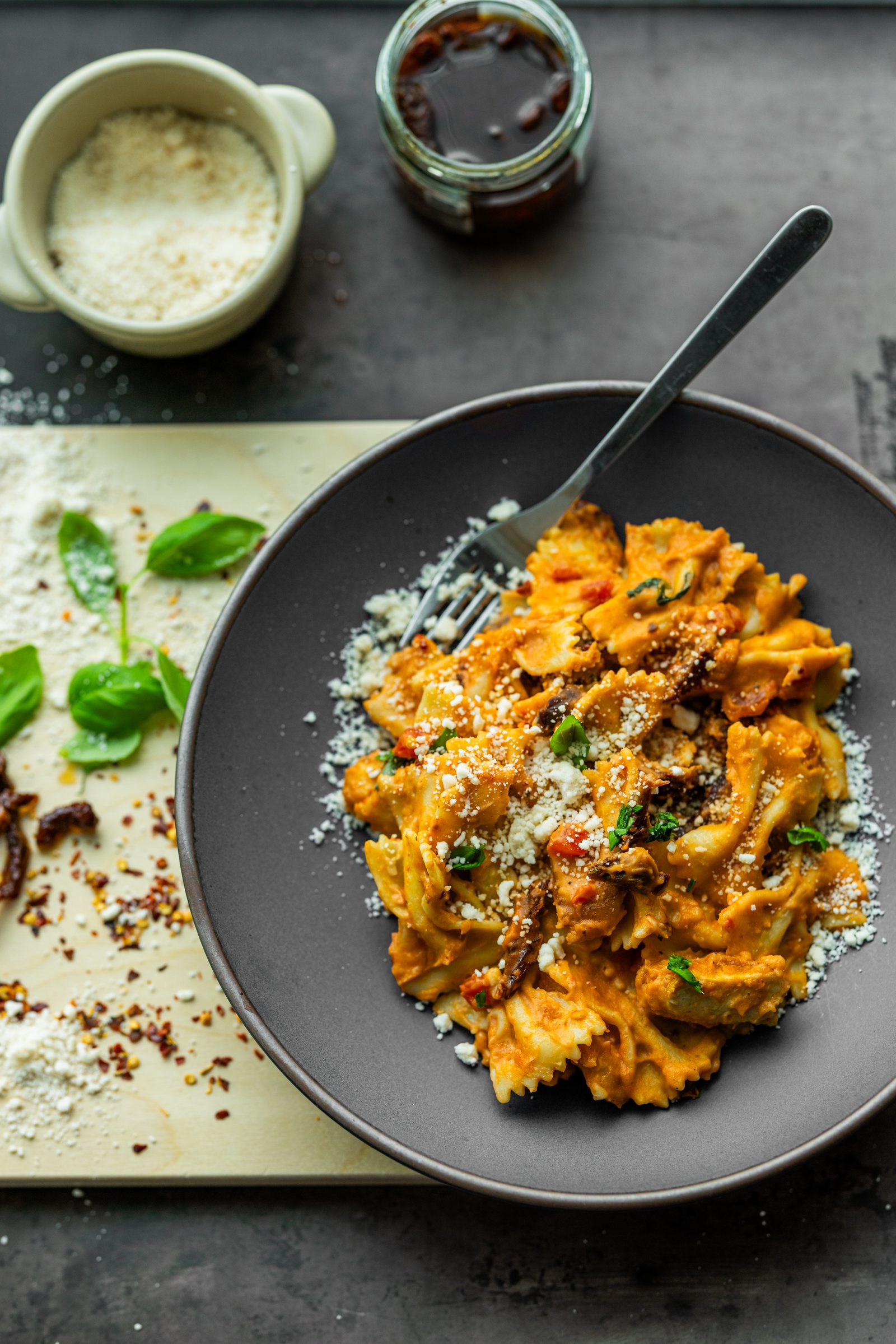 Bowtie pasta coated in a creamy white bean sauce with sun-dried tomatoes, garlic, and a hint of spice.
