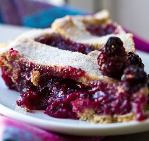 Vegan fresh blackberry pie with a woven pastry crust and juicy berry filling.