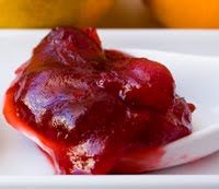 Bright red cranberry sauce in smooth and chunky versions, made with fresh cranberries and citrus for Thanksgiving.