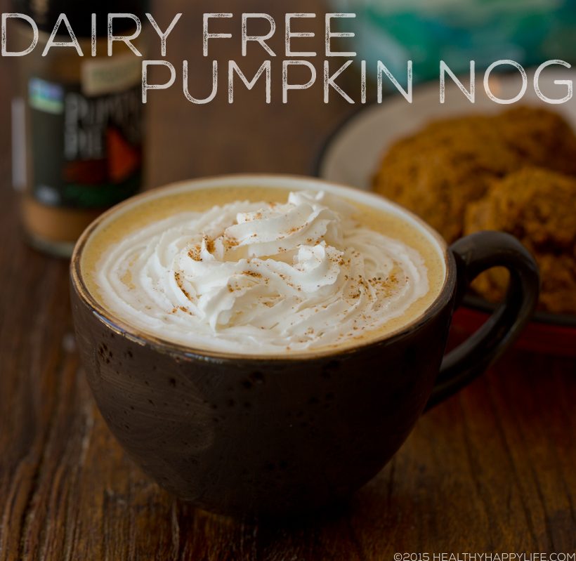 Creamy vegan pumpkin nog in a mug topped with a swirl of non-dairy whipped cream and warming spices.