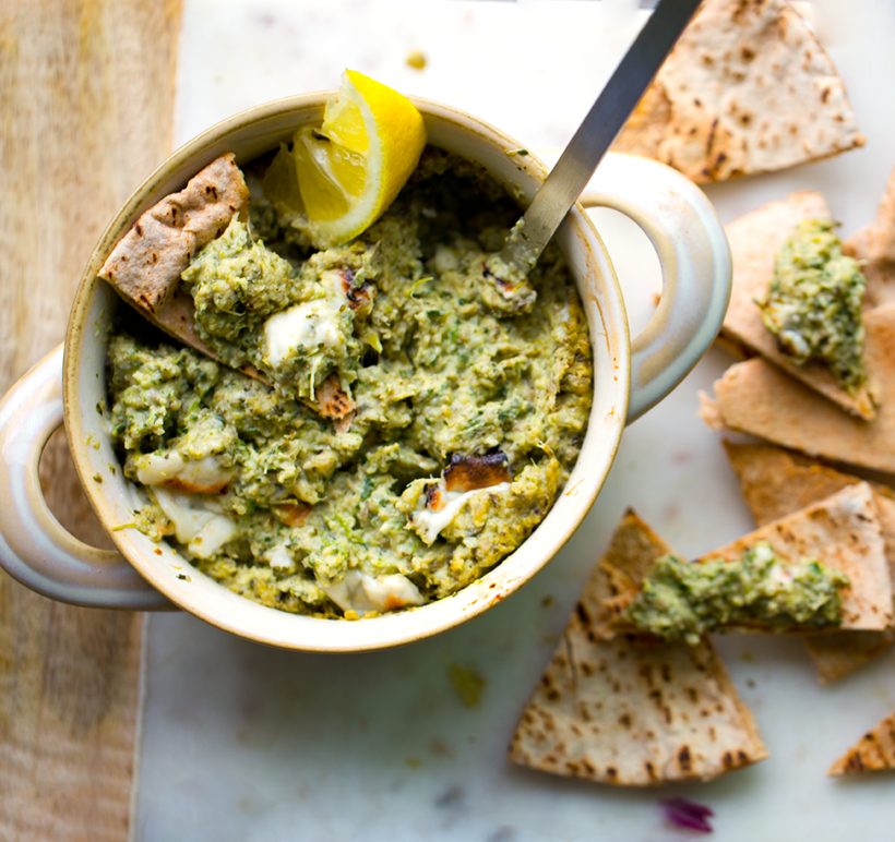 Warm lemon and garlic artichoke spinach dip topped with melty vegan cheese.