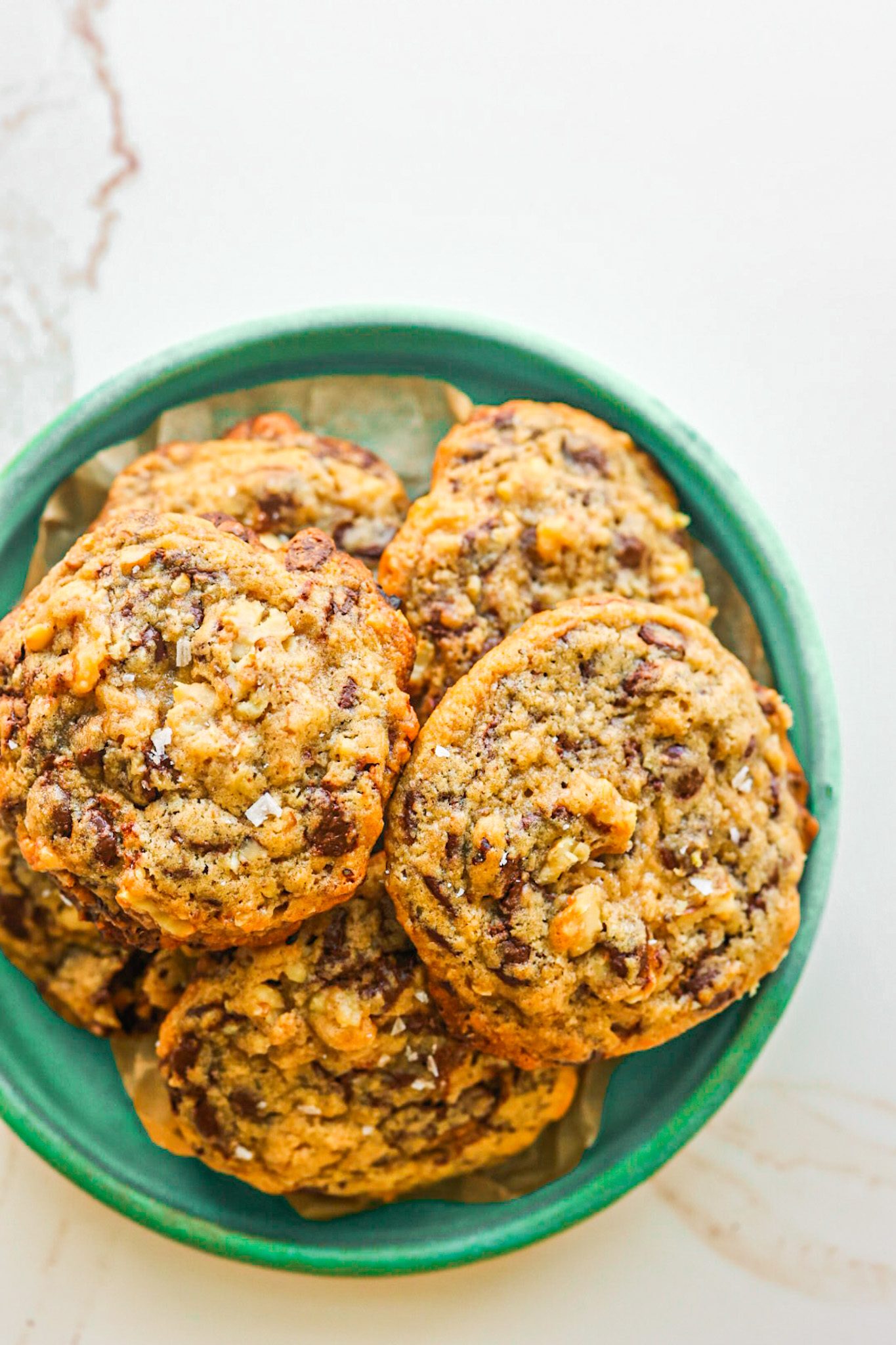 Vegan chocolate chip cookies with chunky walnuts, crisp edges, and gooey chocolate centers.