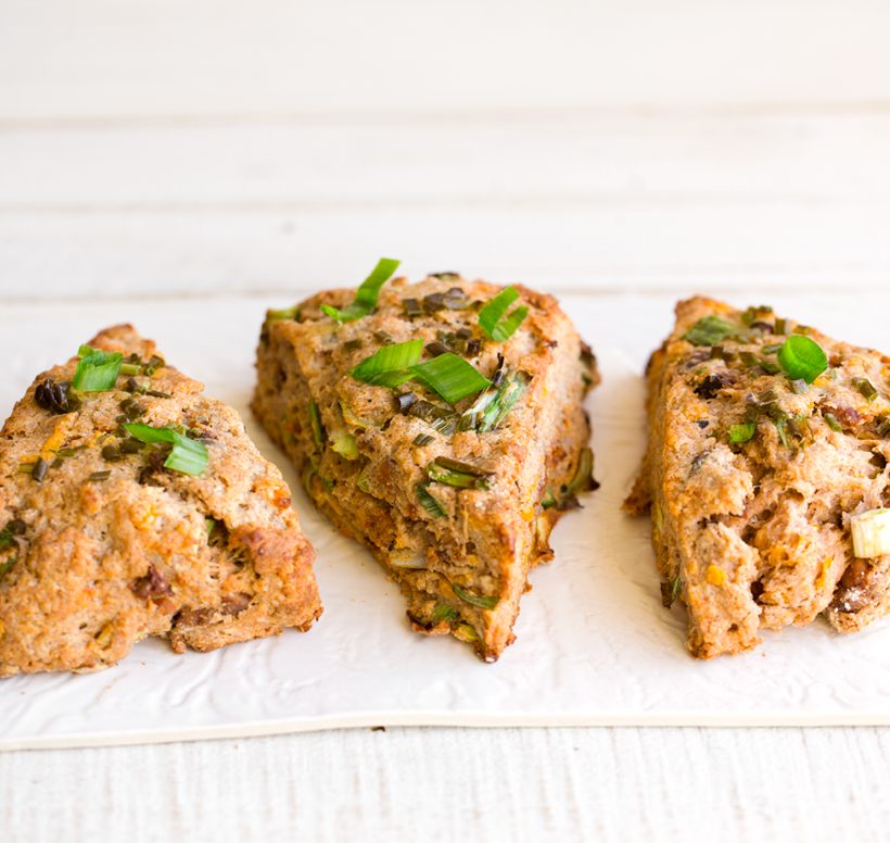 Flaky vegan savory scones filled with vegan cheddar, scallions and tempeh-bacon.