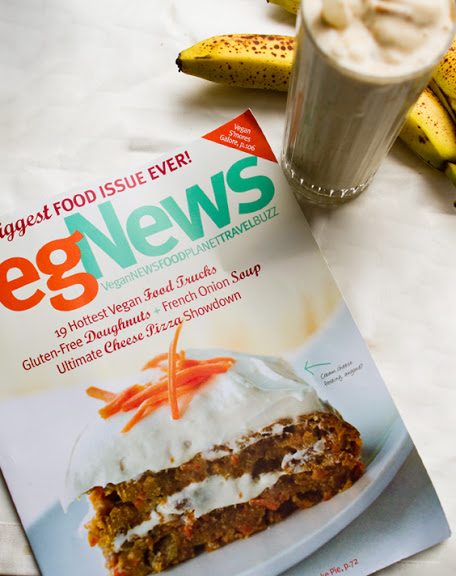 A VegNews magazine cover featuring vegan pumpkin carrot cake, celebrated with a banana peanut butter shake.