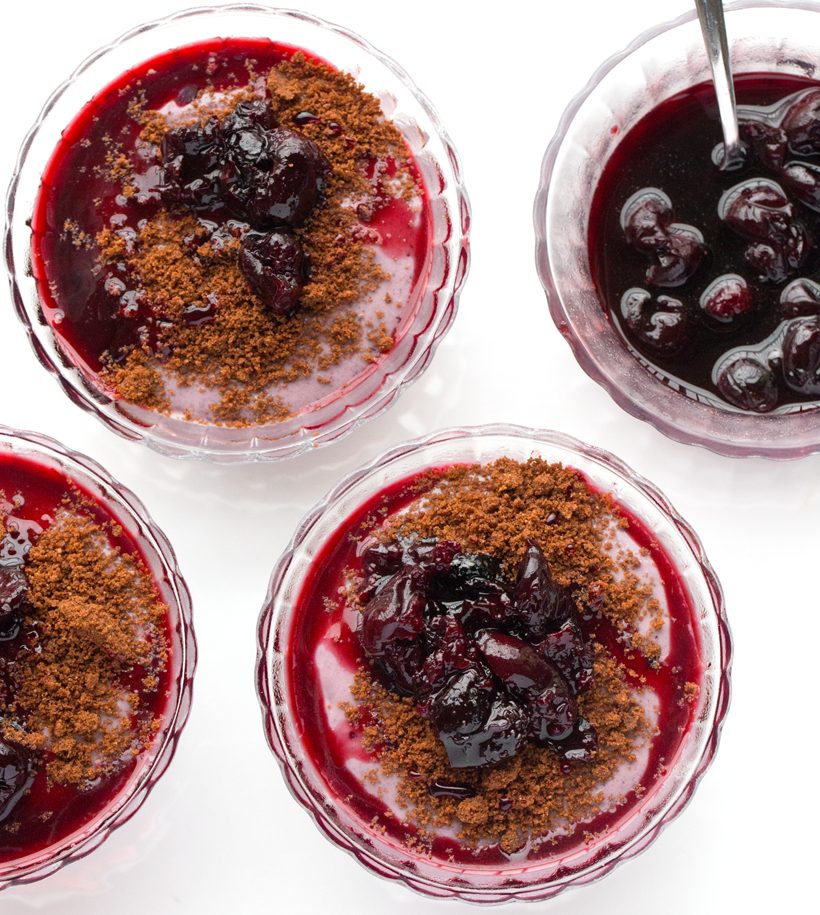 Silky cherry tofu pudding layered with crumbly chocolate cookies and topped with cherries in parfait glasses.