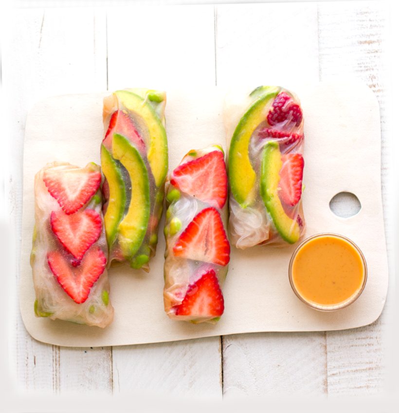 Rice paper summer rolls filled with strawberries, avocado, mung bean noodles and crispy coconut bacon.