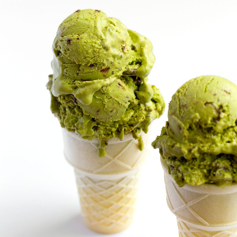 Bright green matcha mint ice cream dotted with finely chopped dark chocolate chunks.