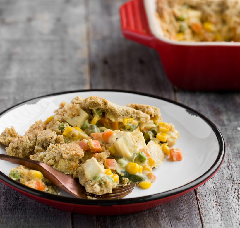 Country-style tofu pot pie with peas, carrots and creamy cashew filling beneath a flaky crust.