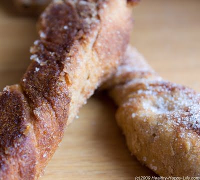 Long, twisted whole wheat bread flutes coated with cinnamon sugar and studded with raisins and hazelnuts.