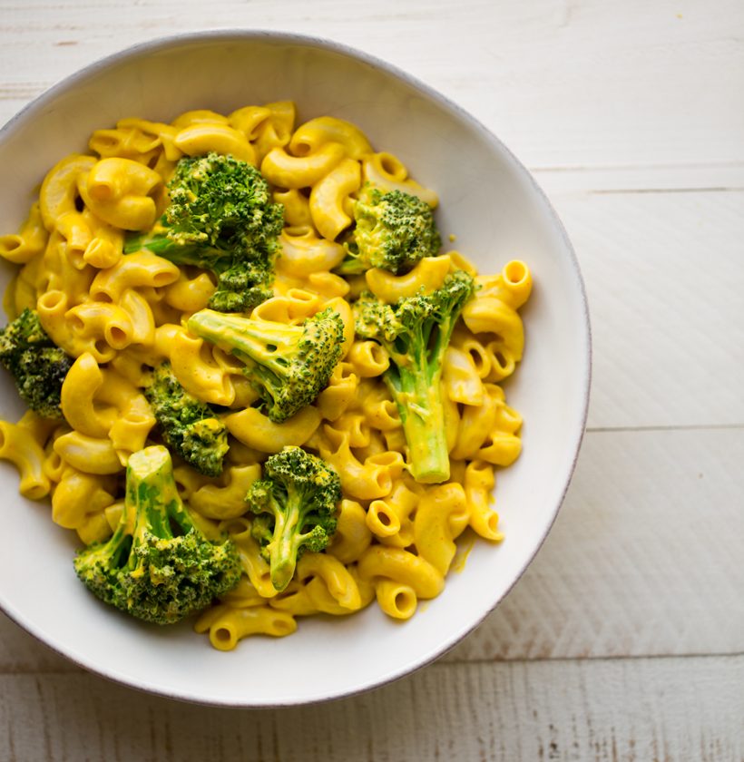 Elbow pasta and broccoli coated in a creamy golden vegan cheese sauce made with cashews and sweet potato.